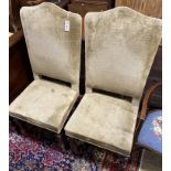 A pair of 17th century high back upholstered chairs (restorations), width 53cm, depth 46cm, height