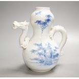 A Japanese Hirado blue and white 'dragon' wine pot, late 19th century, of double gourd shape, (