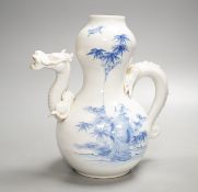 A Japanese Hirado blue and white 'dragon' wine pot, late 19th century, of double gourd shape, (