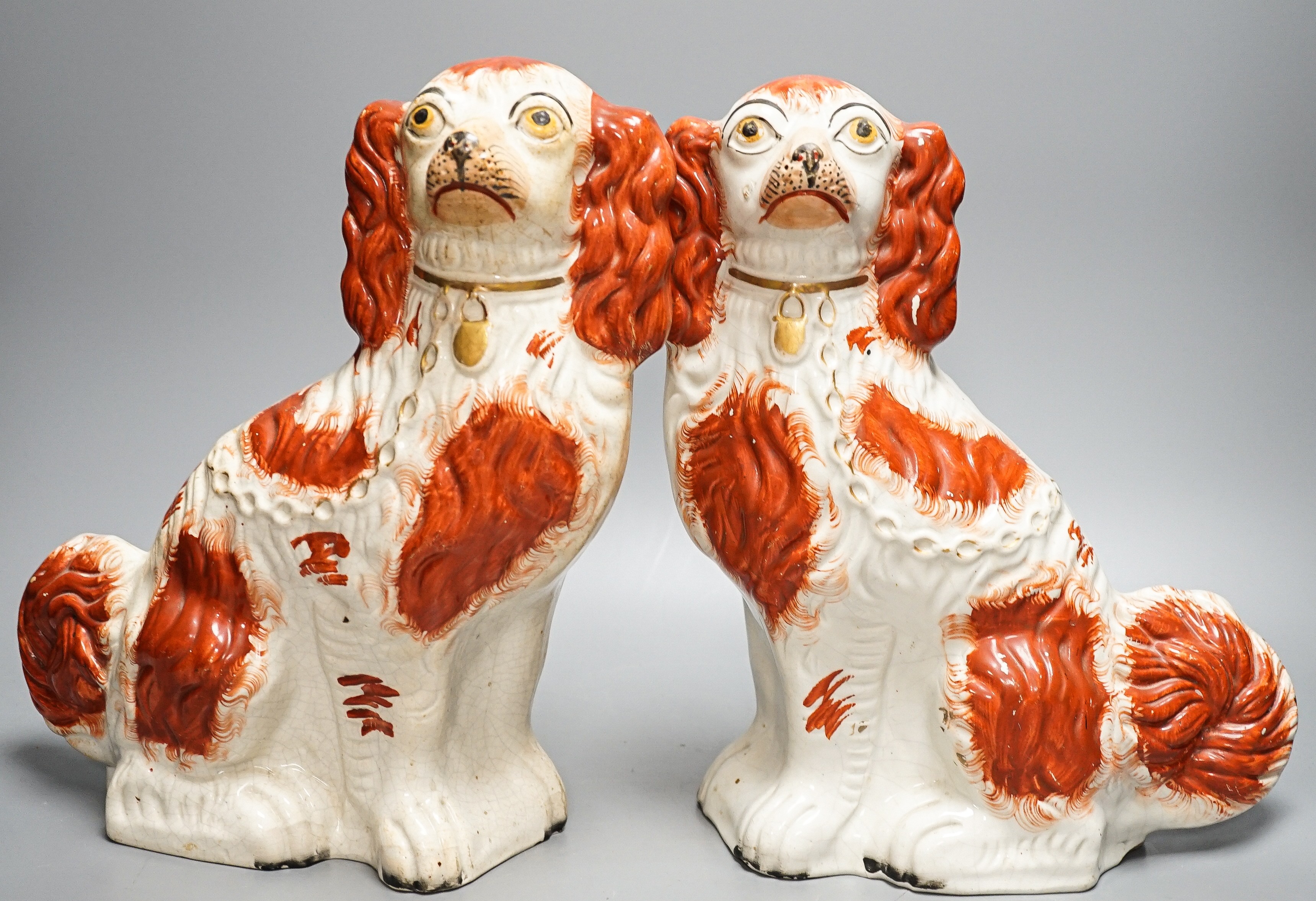 A pair of Victorian Staffordshire Spaniel chimney dogs and a greyhound, chimney dogs 31 cms high. - Image 7 of 8