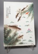 A Chinese famille rose porcelain rectangular plaque, Republic period (1912-49), painted with fish in