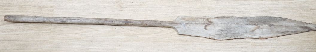 A Polynesian paddle spear, head carved ‘Buruno .E.N.S.O.K Botaki’? Total length 146cm