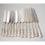 A set of six modern silver handled steel Kings pattern table knives and six matching dessert knives,