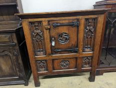 A Garrard Radiogram in a Gothic revival carved oak case. W-98cm,D-49cm, H-101cm.