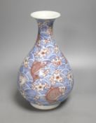 A Chinese underglaze blue and copper red pear-shaped vase, 31 cms high.