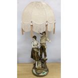 After L & F Moreau - a painted spelter figural table lamp, peasant girl and boy, 96 cms high