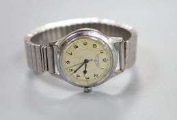 A gentleman's mid 20th century stainless steel Longines manual wind wrist watch, on associated