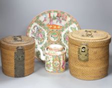 Three late 19th/early 20th century Chinese famille teapots, two in baskets and a similar dish,