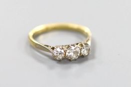 An 18ct & Pt, three stone diamond ring, size M, gross 2.4 grams.