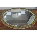 A large oval barbola framed mirror. W-115cm, H-85cm.