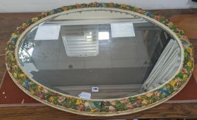 A large oval barbola framed mirror. W-115cm, H-85cm.