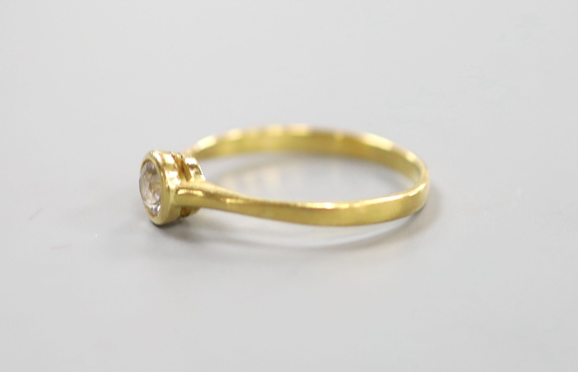 A yellow metal and collet set solitaire diamond ring, size P, gross weight 1.9 grams,the stone - Image 2 of 3