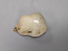 A Chinese whiteish grey jade carving of a peach branch sprig, 19th century, 4.2cm