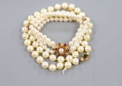 A modern triple strand cultured pearl bracelet, with 9ct clasp, approx. 17cm and a single strand