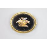 A Victorian yellow metal mounted oval micro mosaic brooch, decoration with the Pliny doves, 38mm.