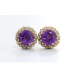 A pair of 9ct gold, amethyst and diamond chip set circular cluster ear studs (lacking