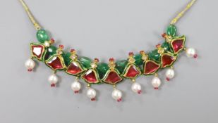 An Indian? emerald, garnet, ruby, enamel and cultured pearl set drop necklace, with fabric chain,