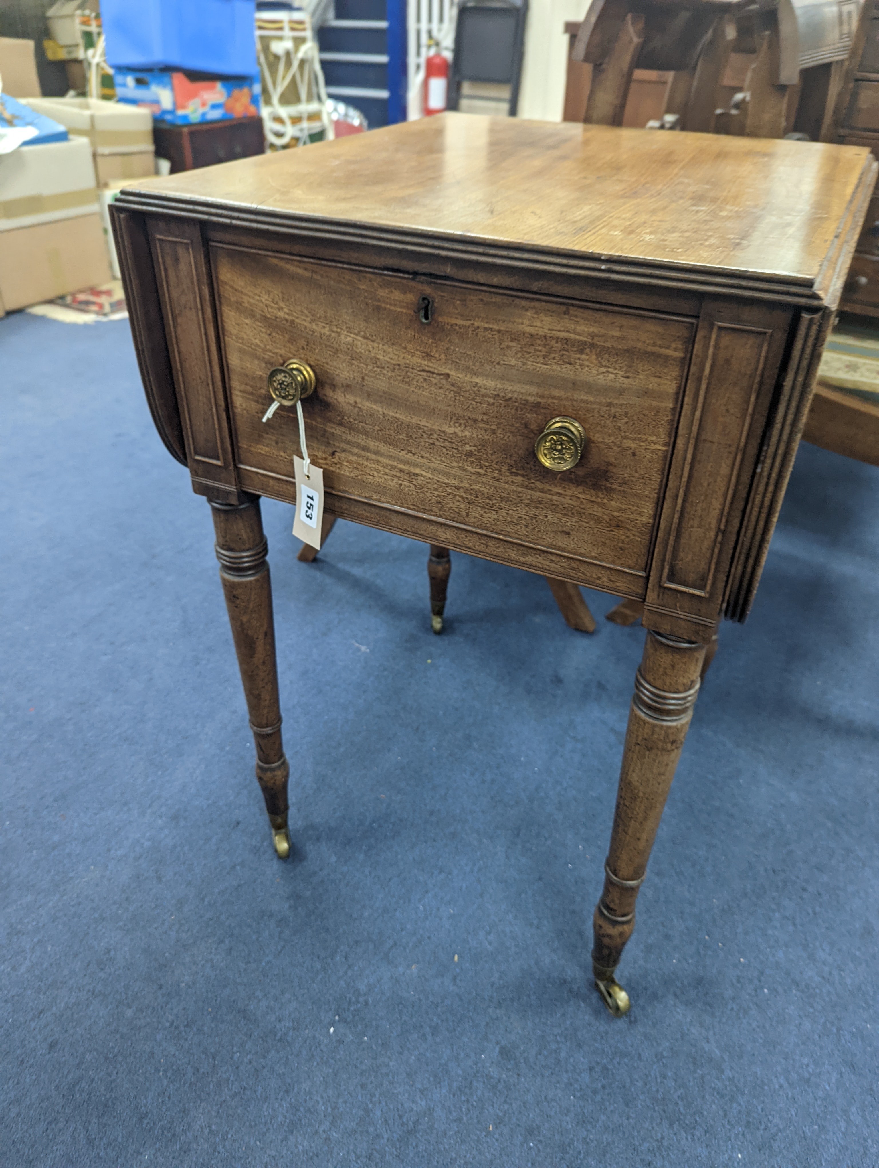 A Regency mahogany drop flap work table with twin fall compartments, width 48cm, depth 54cm,