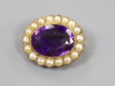 A late Victorian yellow metal, amethyst and split pearl set oval brooch, 28mm, gross weight 10.3