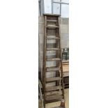 A vintage 8 tread wooden step ladder. H-224cm.