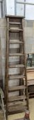 A vintage 8 tread wooden step ladder. H-224cm.