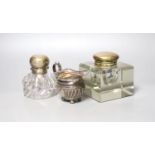 A late Victorian silver cream jug and two silver mounted glass inkwells.