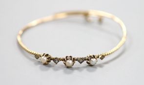 An antique yellow metal, rose cut diamond and pearl(untested) set bangle, gross weight 6.5 grams.