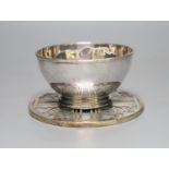 A George V silver bowl, Birmingham, 1910 and a silver mounted glass coaster.