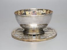 A George V silver bowl, Birmingham, 1910 and a silver mounted glass coaster.