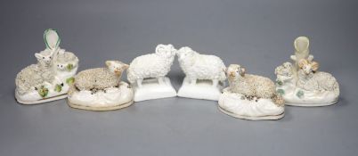 Two pairs of Staffordshire porcelain figures of sheep and two similar ‘sheep’ spill vases, c.1830-