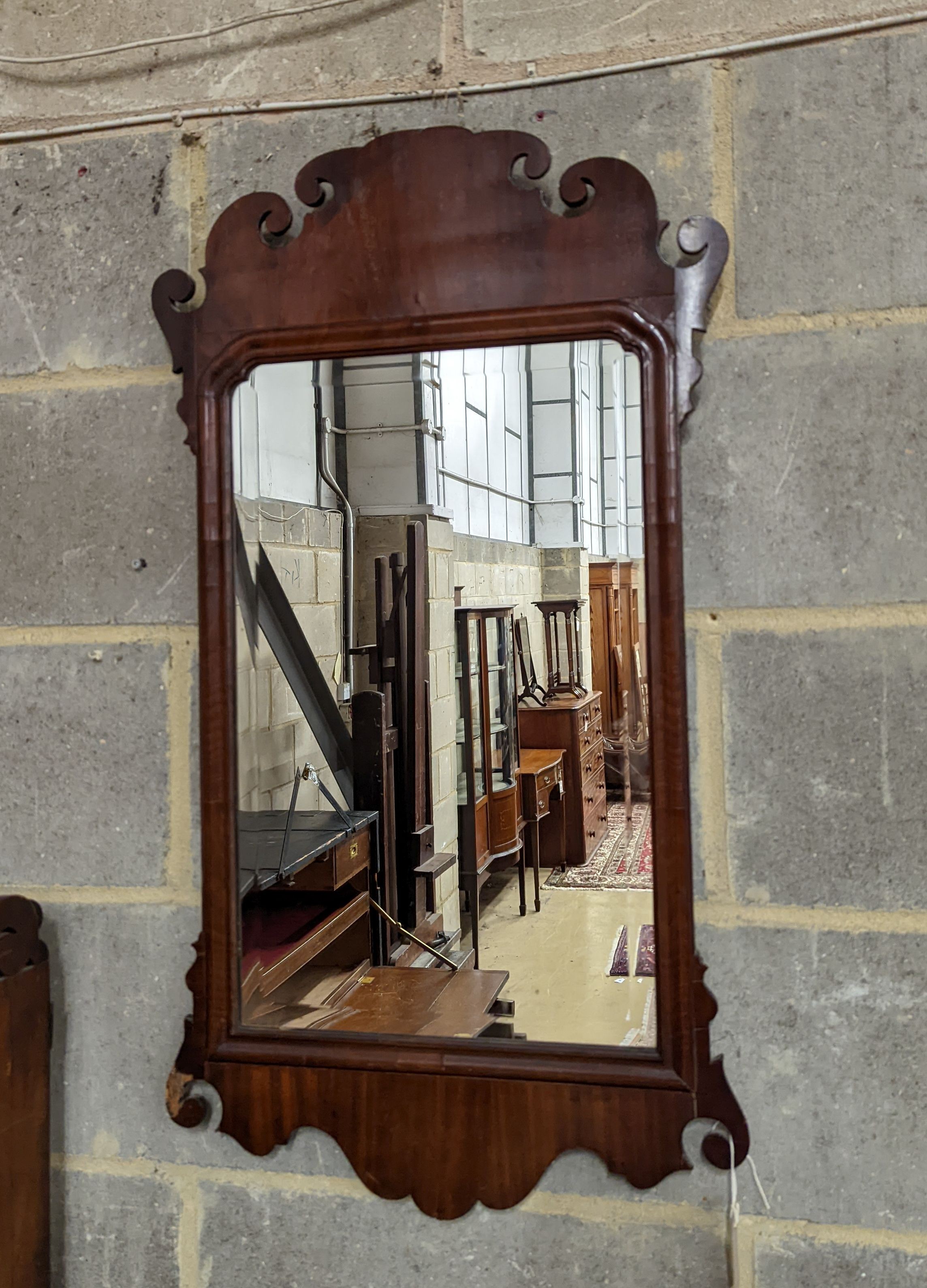 A George II style Fret cut mahogany wall mirror. Length - 86cm, Width - 48cm.