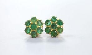 A pair of yellow metal and emerald flower head cluster set earrings, 12mm, gross 4.9 grams.