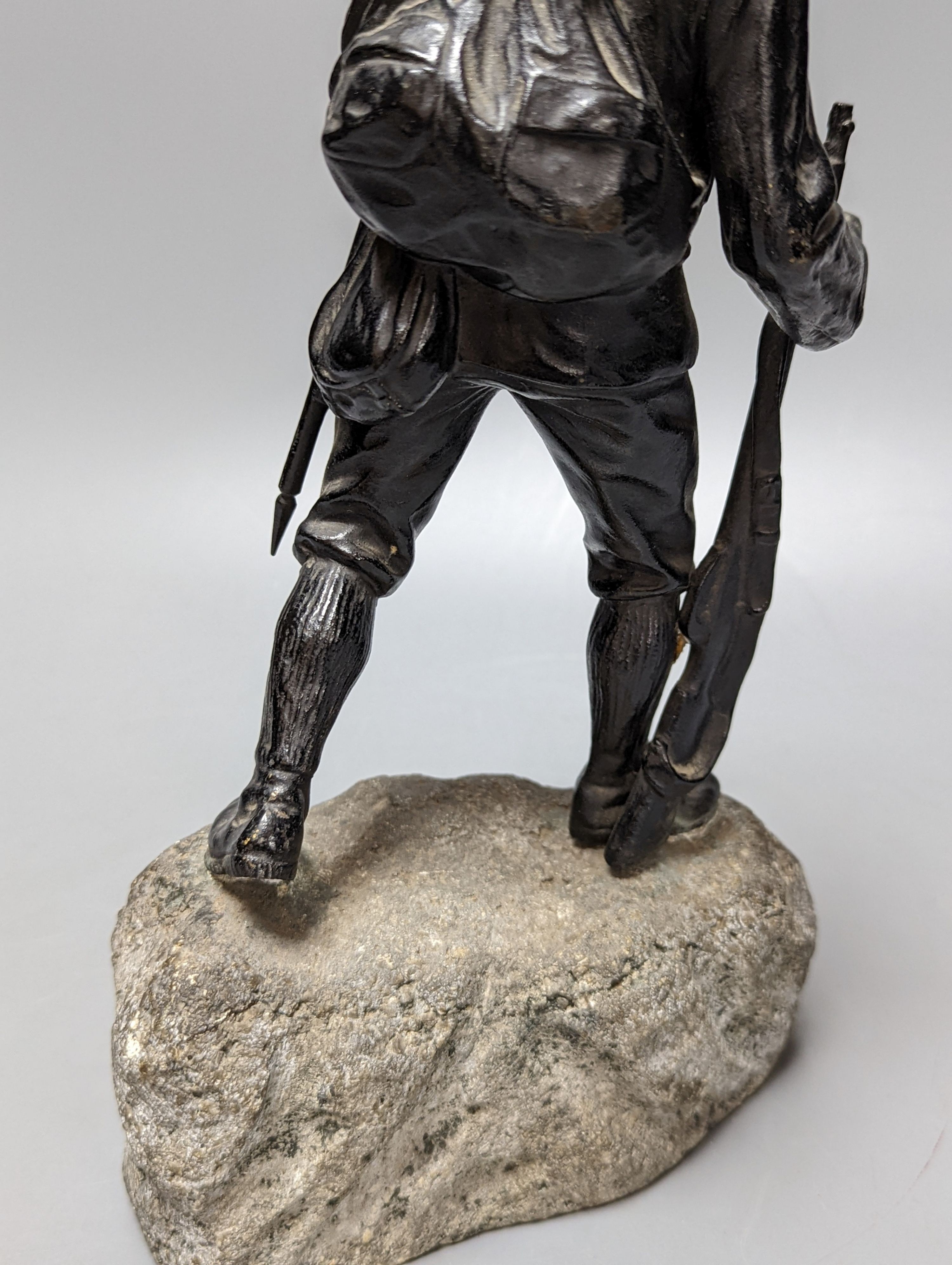 A WW1 period bronze figure of an Austrian soldier, 30 cms high including stone base. - Image 6 of 6