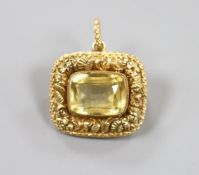 A Victorian foliate embossed yellow metal and citrine set mourning pendant brooch, with glazed back,