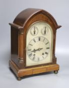 An inlaid mahogany lancet shaped chiming mantel clock with silvered dial, circa 1900. Pendulum and