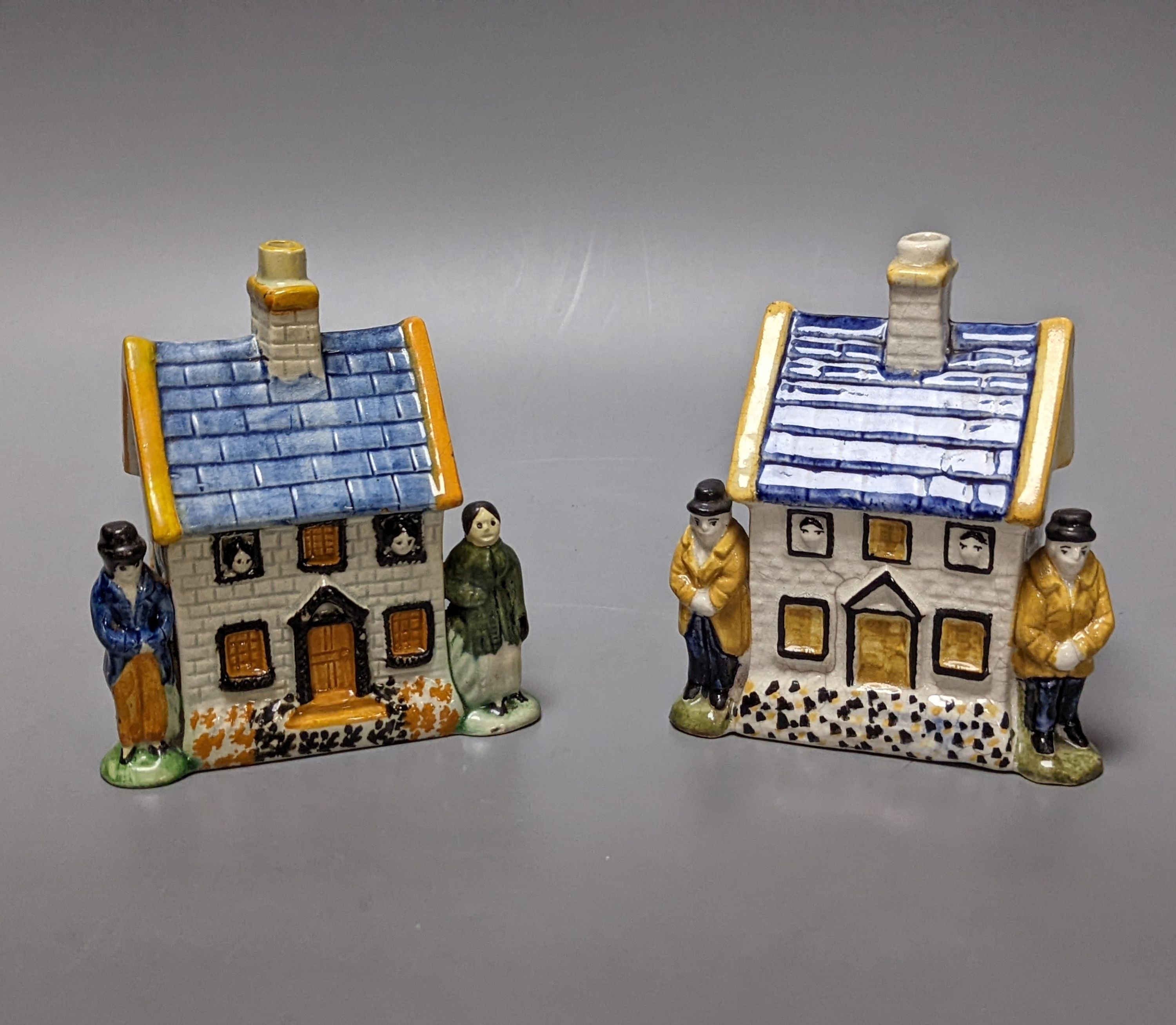 A Staffordshire Prattware money box, c.1810, and another later example (2) both 12.5cm, faults
