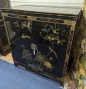 A Chinese lacquer media cabinet. W-94cm, D-61cm, H-102cm.