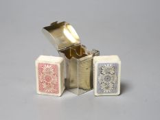 A late Victorian silver playing card case, containing two later? packs of playing cards, Henry