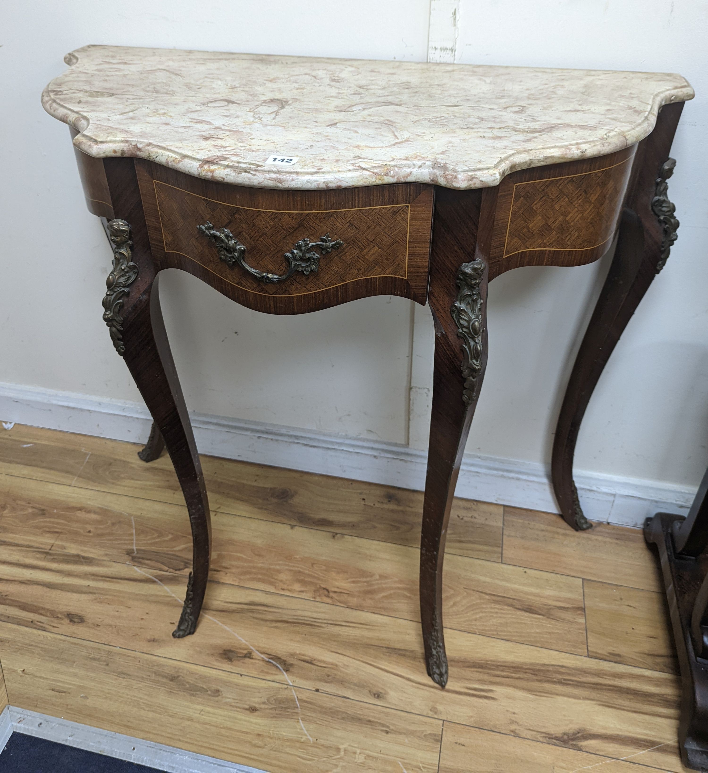 A Louis XVI design marble top serpentine console table. W-102cm, D-47cm, H-91cm.