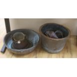 Two large copper bowls and related items, largest 54 cms diameter.