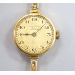 A lady's early 1920's 18ct gold Rolex manual wind wrist watch, with case back inscription, on a