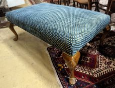 An upholstered footstool. W-117cm, D-73cm, H-44cm.