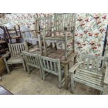 A weathered teak rectangular garden table and six elbow garden chairs, not matching. Table measures,