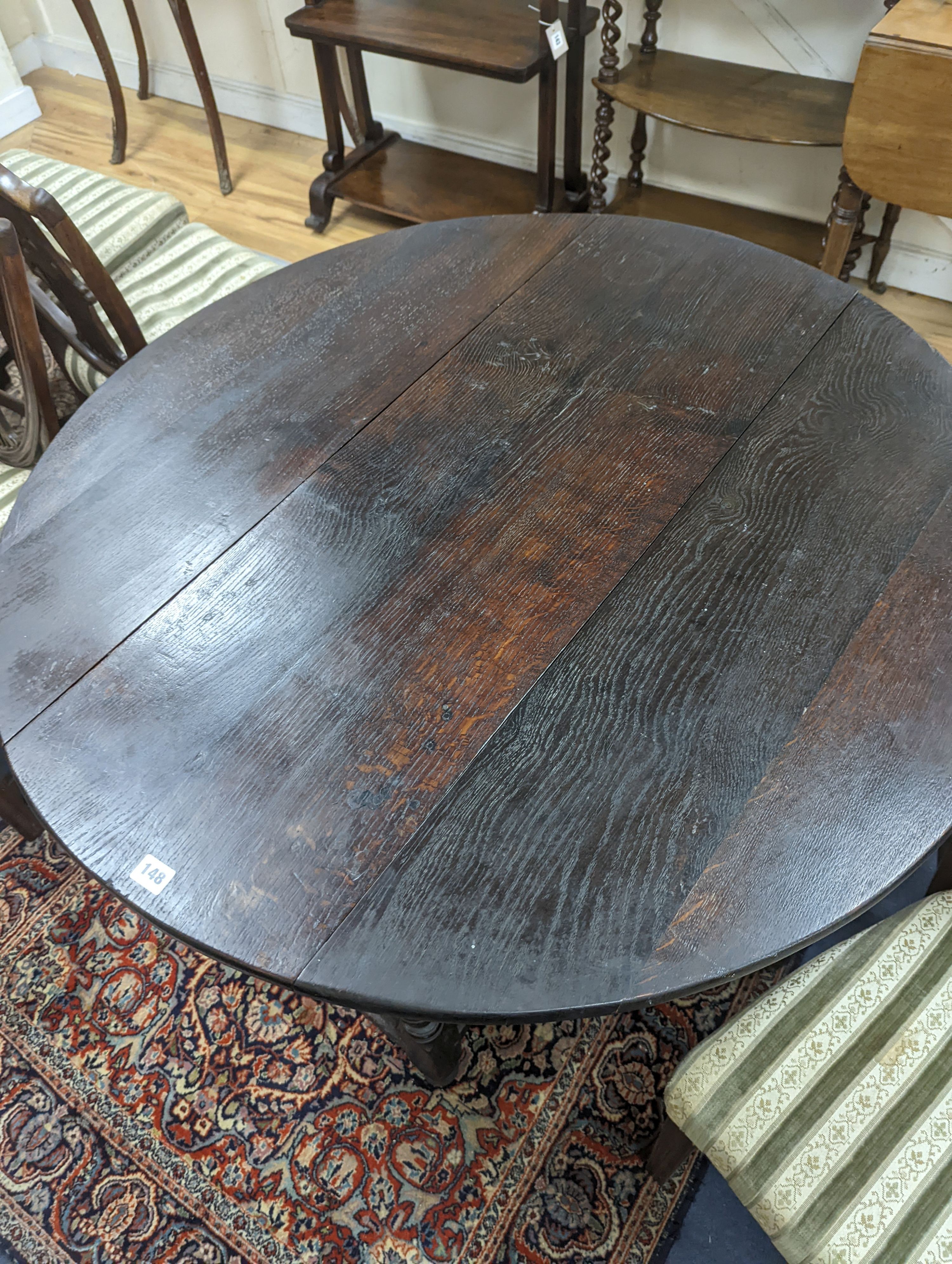 An oak gateleg table. W-107cm, D-105cm, H-73cm. - Image 2 of 4