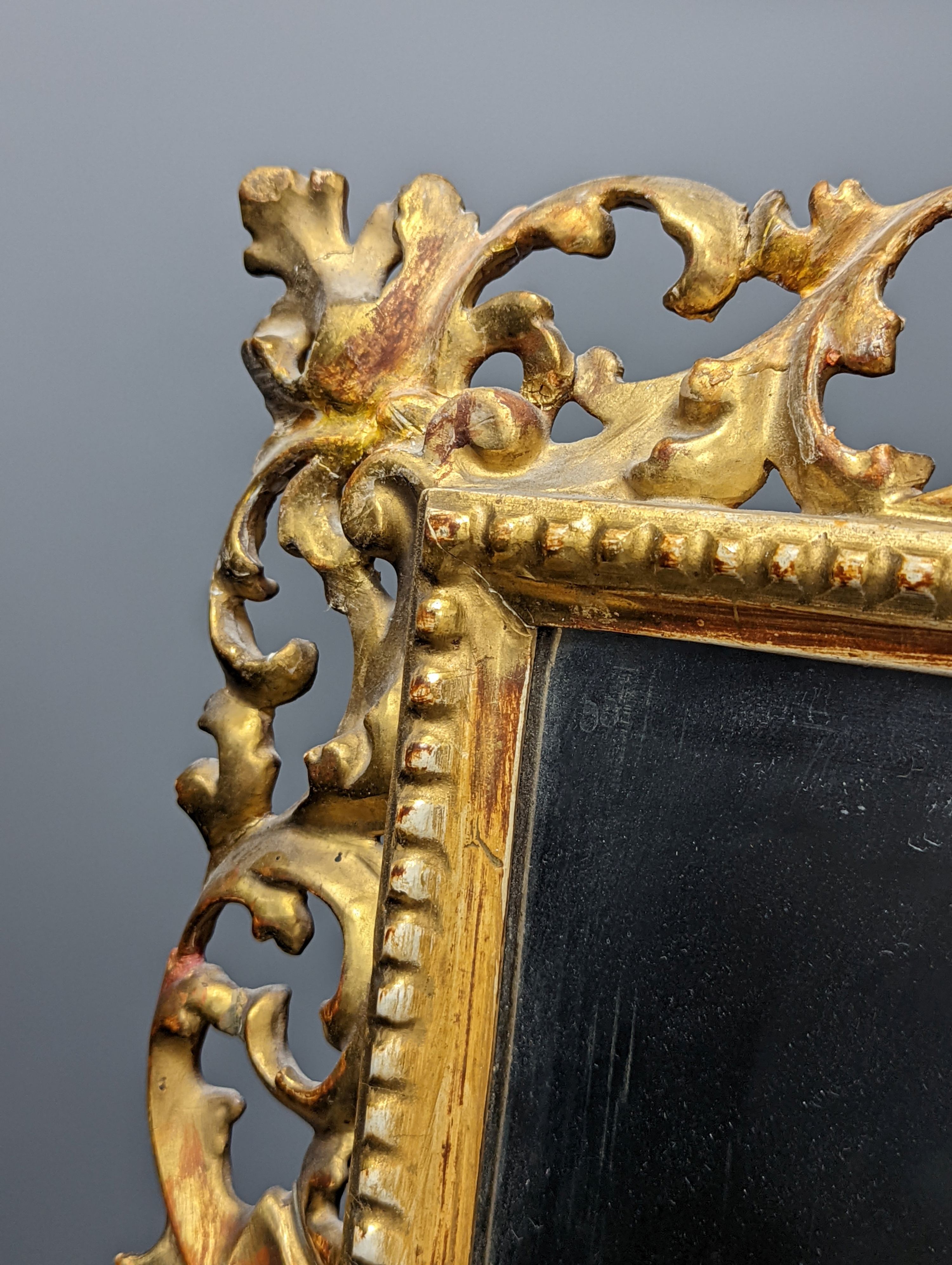 A Florentine giltwood framed mirror, with later easel back, 54 cms high x 43 cms wide. - Image 5 of 7