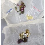 A quantity of assorted loose cut gemstones including sapphires, aquamarine, citrine and