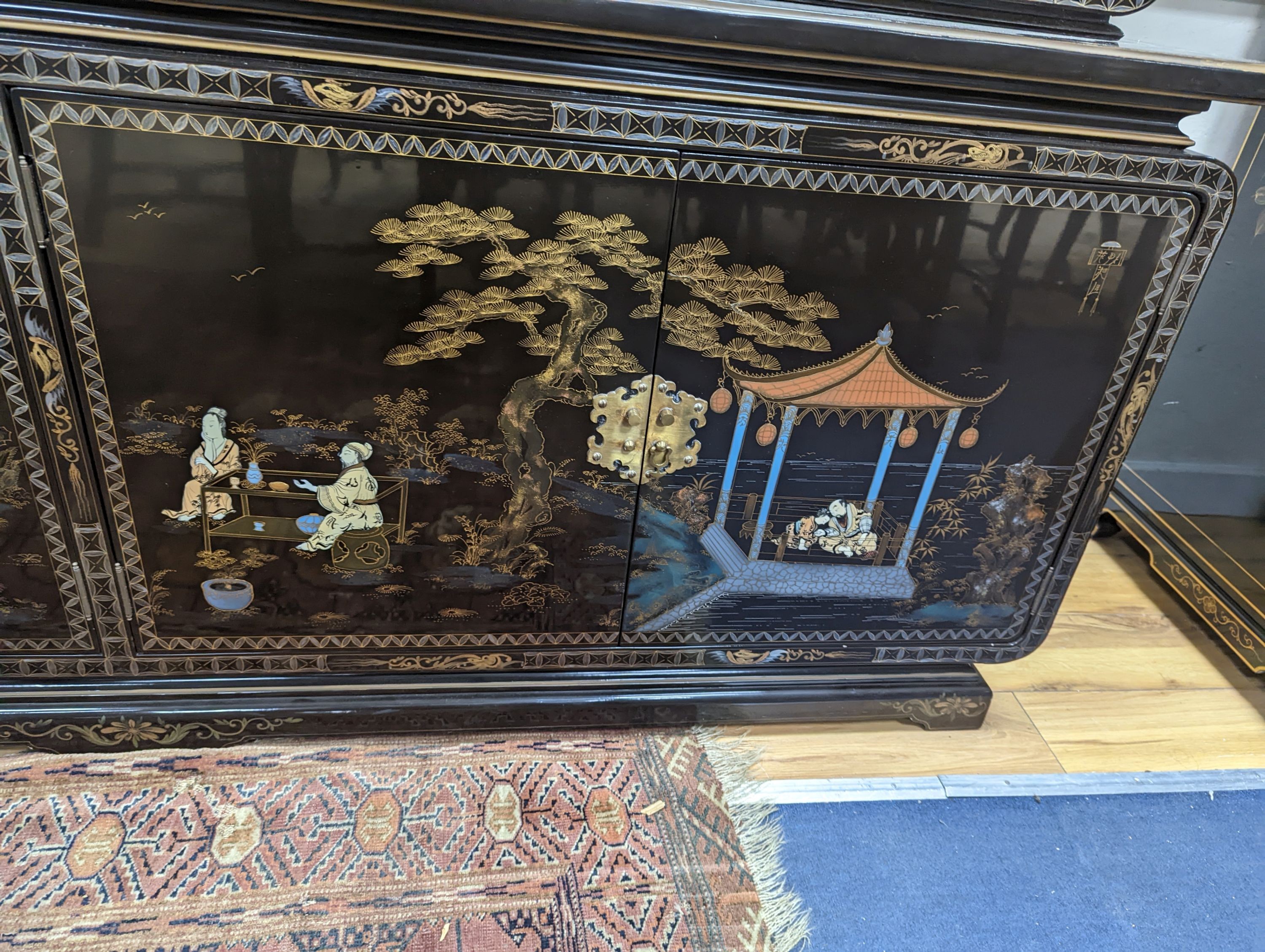 A Chinese lacquer decorated cabinet. W-200cm, D-45cm, H-201cm. - Image 3 of 4