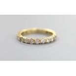 A modern 18ct gold and diamond set full eternity ring, size P, gross weight 3.8 grams.