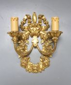 Two pairs of 18th century style Italian giltwood two branch wall lights and one other wall light, 62