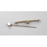 A yellow metal and solitaire diamond set bar brooch, 50mm and a single stone opal set stick pin.